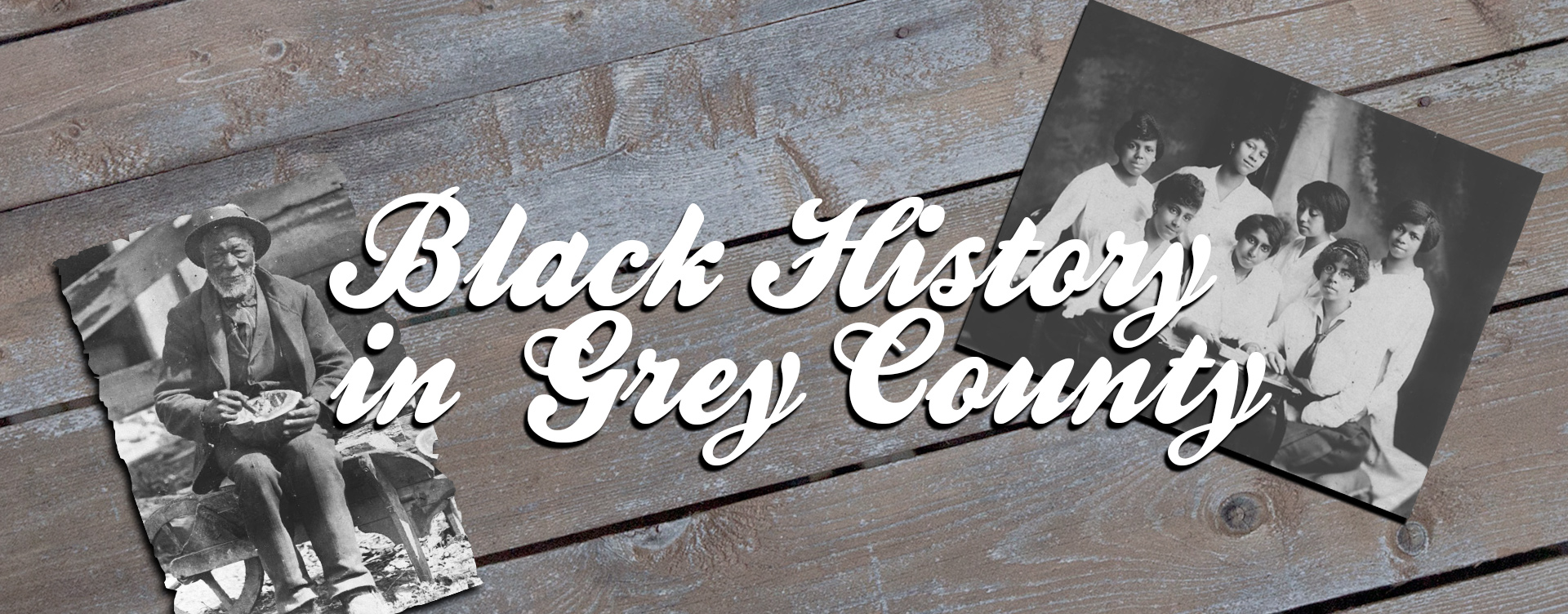 Two historical photographs on a table