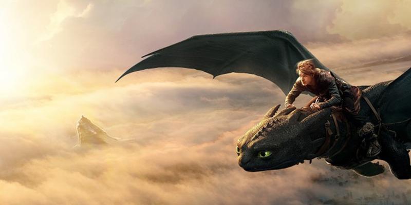 A person riding a large dragon with black scales and green eyes, flying above the clouds with a mountain peak visible in the distance. The sun is shining brightly, casting a golden hue over the scene.