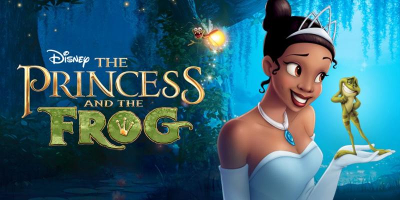 Promotional poster for Disney’s The Princess and the Frog. The image features the movie title in ornate gold lettering on the left, set against a glowing blue and green bayou background with hanging vines. On the right, a character in a white gown and tiara holds a small green frog in one hand, while a glowing firefly hovers nearby.